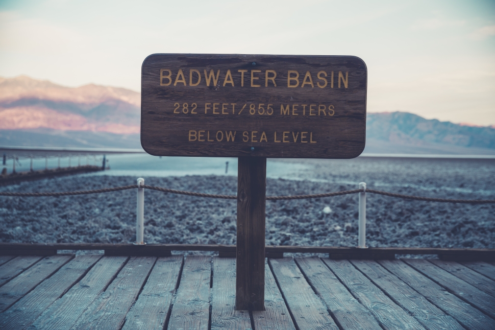 badwater basin signage on brown wooden hallway preview